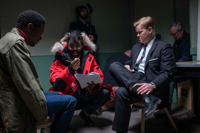 Shaka King (center) directs Stanfield as Bill O'Neal and Jesse Plemons as FBI Agent Roy Mitchell (right).