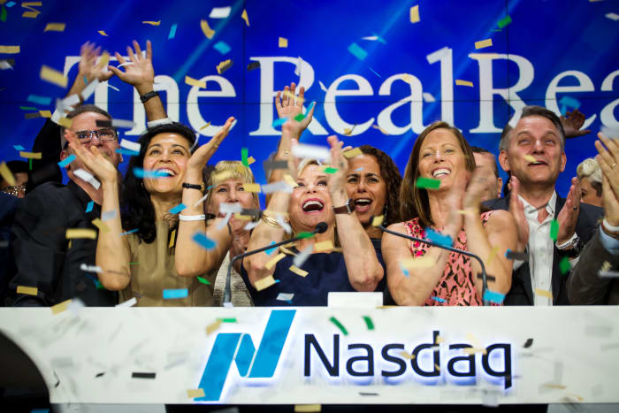 The RealReal Inc. executives applaud while ringing the opening bell during the company's IPO at the Nasdaq MarketSite in New York City in June 2019.