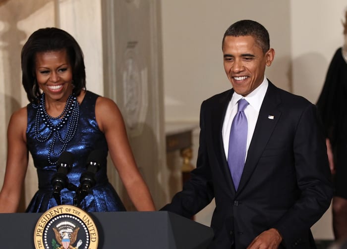 Michelle Obama, wearing Rodarte, with former president Barack Obama at a Hanukkah reception in 2011.