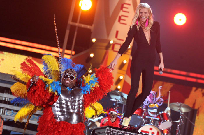 Gwyneth Paltrow, with Cee-Lo Green, performing on stage at the 2011 Grammys, wearing pink earrings by Wilfredo Rosado.