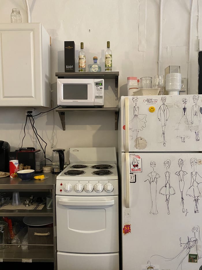 The kitchen in the studio. (Those are Cohen's doodles on the refrigerator door.)