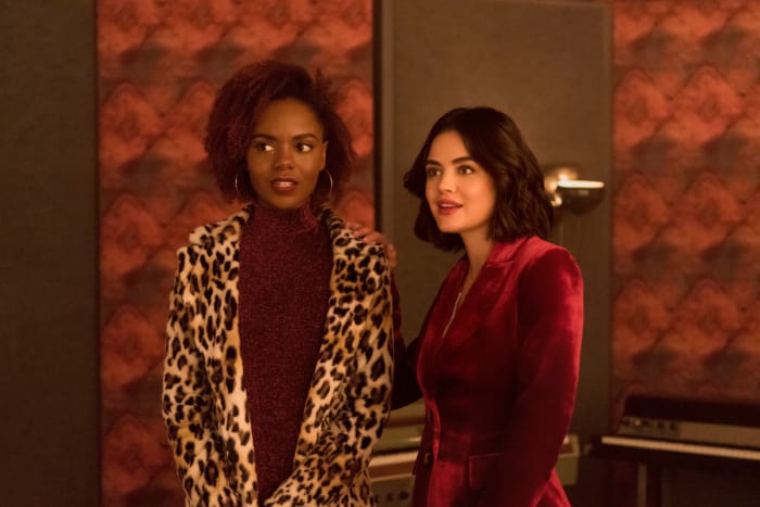 Josie in an H&M coat and Katy in a custom pantsuit in the pilot.