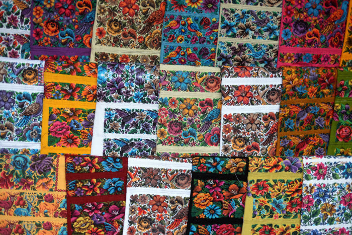 Huipiles on display at a market in Sumpango, Guatemala in 2013.