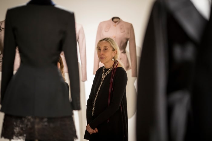 Carla Sozzani admires Alaïa's designs, with Adrian's behind her, at the opening reception of 'Alaïa-Adrian: Masters of Cut' at the SCAD FASH Museum of Fashion + Film in Atlanta.