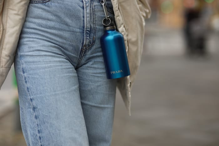 Prada's much-hyped water bottle, pictured here in a Berlin street style shot.