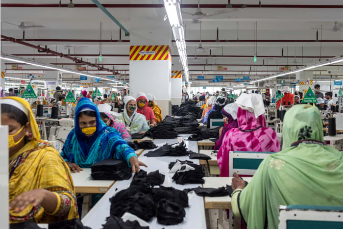 A group of women working in a denim factory in Bangladesh.