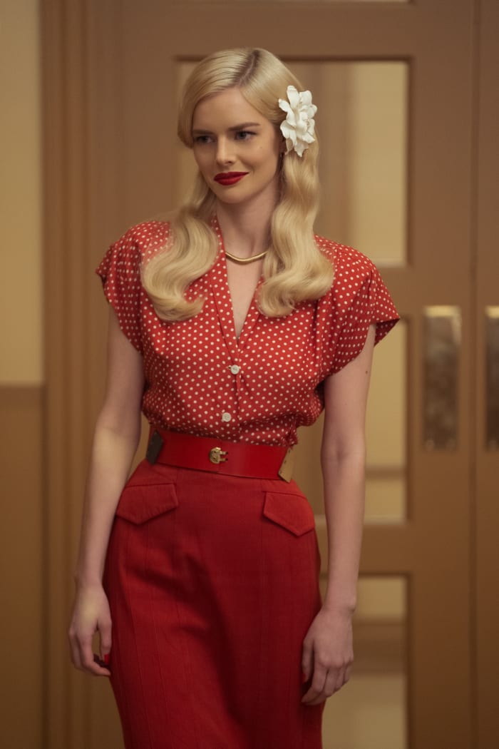 'Red really worked in our color palette, which was harvest colors, so sometimes red gave it that pop or that richness, but it’s also a power color,' says Evelyn of Claire's wardrobe.