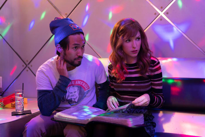 Augie (Jin Ha) and Darby (Anna Kendrick) choose their karaoke go-to.