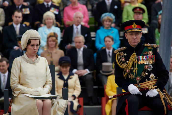 Queen Elizabeth, her hat and Prince Philip at Prince Charles's investiture ceremony.