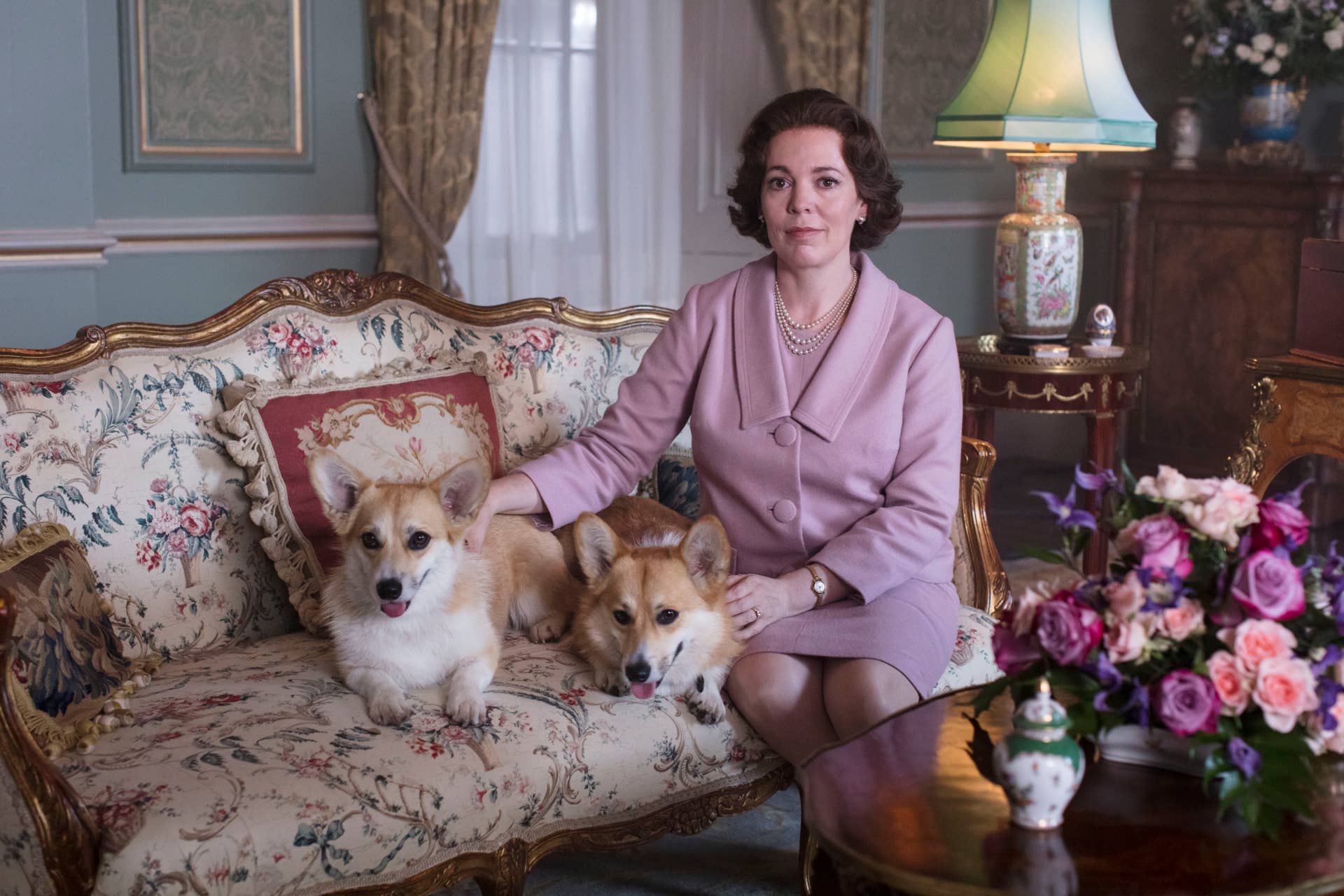 Queen Elizabeth II (Olivia Colman) and her corgis.