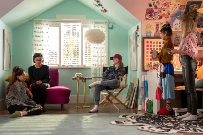 (L–R) Dawn (Xochitl Gomez), Mary Anne (Malia Baker), Kristy (Sophie Grace), Claudia Kishi (Momona Tamada) and Stacey (Shay Rudloph) wait for the landline to ring. Note the shoe-free Kishi household.