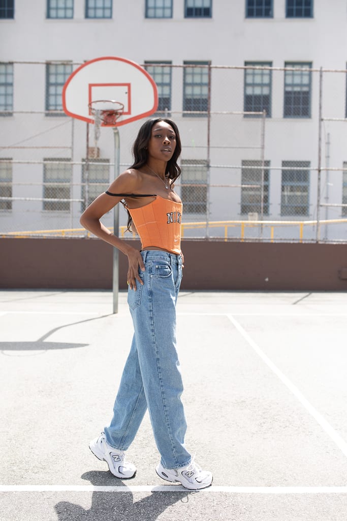 Designer Kayla Sade Famurewa wearing an upcycled Almost On Time corset.