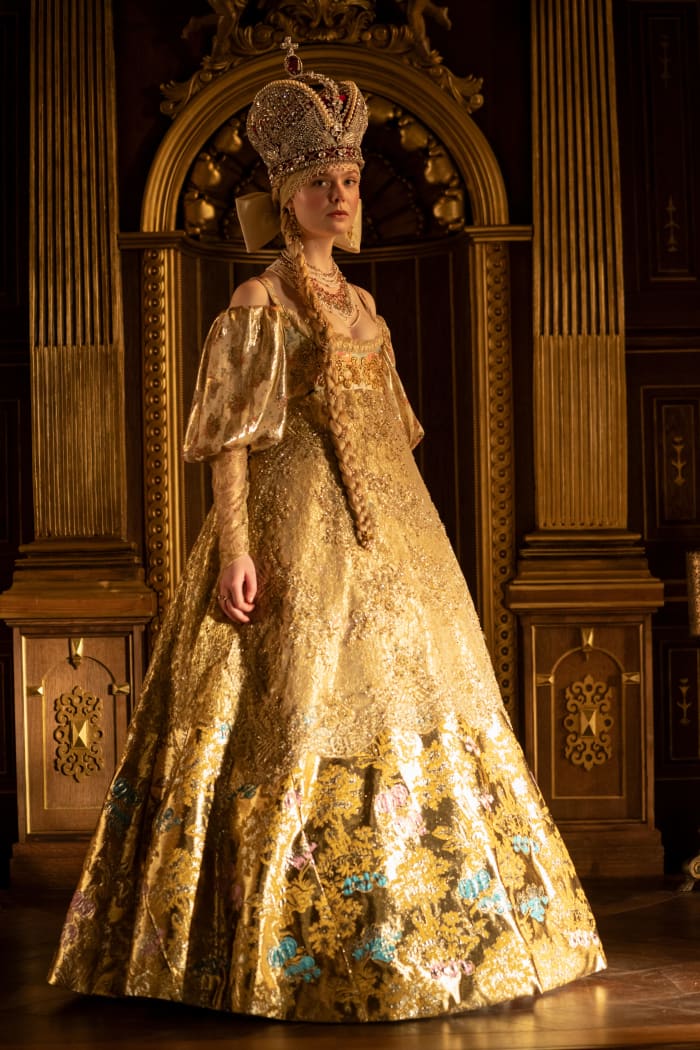 Catherine (Elle Fanning) in a coronation dress. 