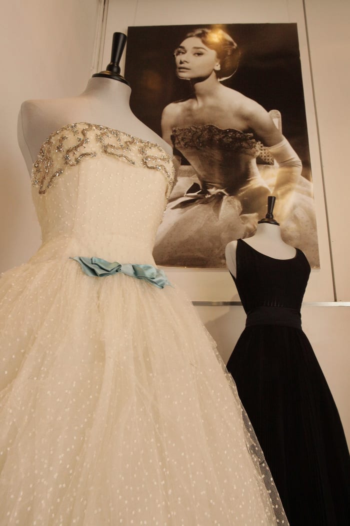 The Givenchy white point d'esprit ball gown (left), which Audrey Hepburn wore in the 1956 film 'Love in the Afternoon.'