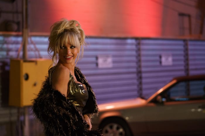 Pam (Lily James) says bye to Tommy after meeting him in the club.