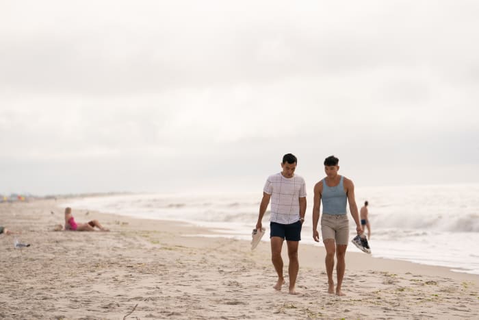 Conrad and Will take a romantic walk on the beach.