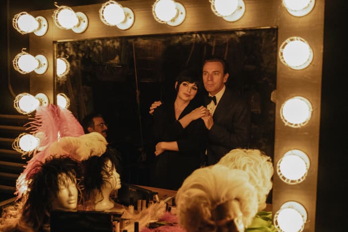 Joe Eula (David Pittu, sitting), Liza Minnelli (Krysta Rodriguez) and Halston (Ewan McGregor).