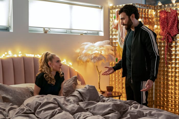 Roy (Brett Goldstein) catching Keeley having an intimate moment with herself and a video of his retirement speech (with the De La Vali dress behind his head).
