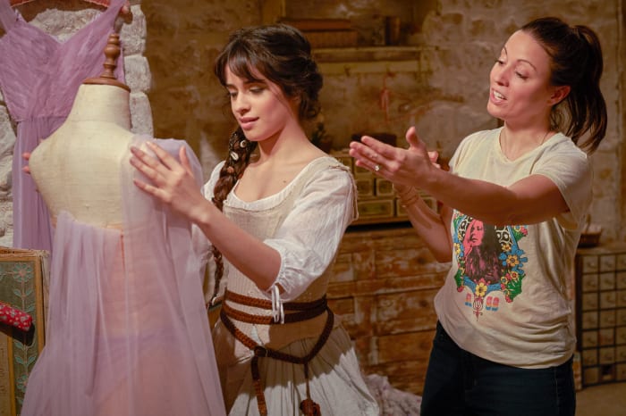 Cabello practicing her draping skills with writer-director Kay Cannon.