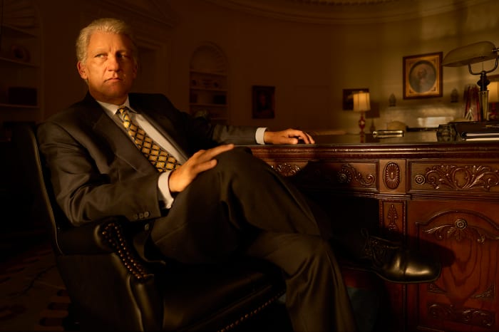 President Bill Clinton (Clive Owen) in his signature suit and printed tie.