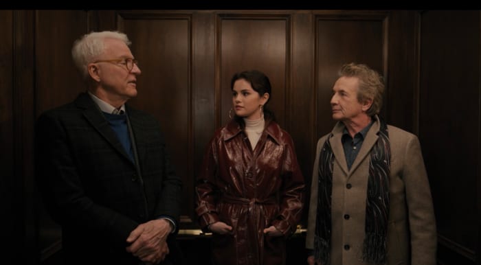 Charles-Haden, Mabel in her detective trench and Oliver leave the building.