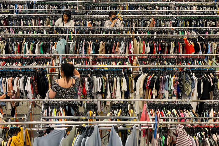 Customers shop among clothing stores in the United States.