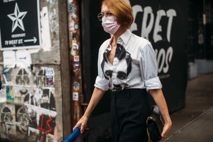 A New York Fashion Week spectator wearing a face mask during the Spring 2022 shows in September 2021.