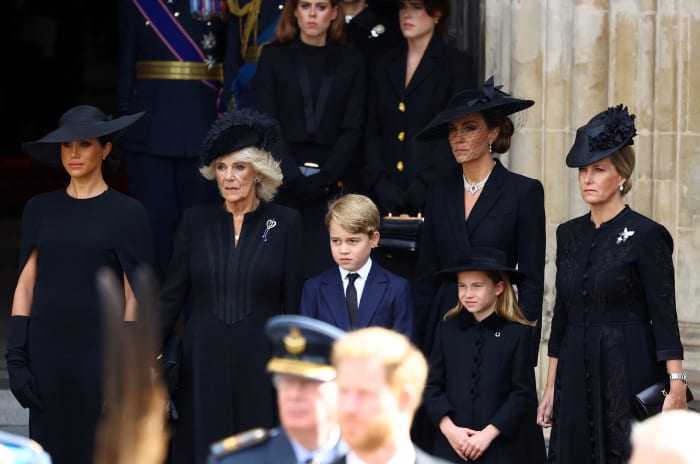 From left to right: Meghan, Duchess of Sussex, Queen Camilla, Prince George, Princess Charlotte, Catherine, Princess of Wales, and Sophie, Countess of Wessex attend Queen Elizabeth II's funeral Monday morning.