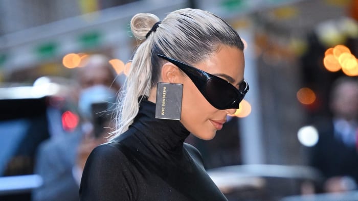 Kardashian, wearing Balenciaga wraparounds. 