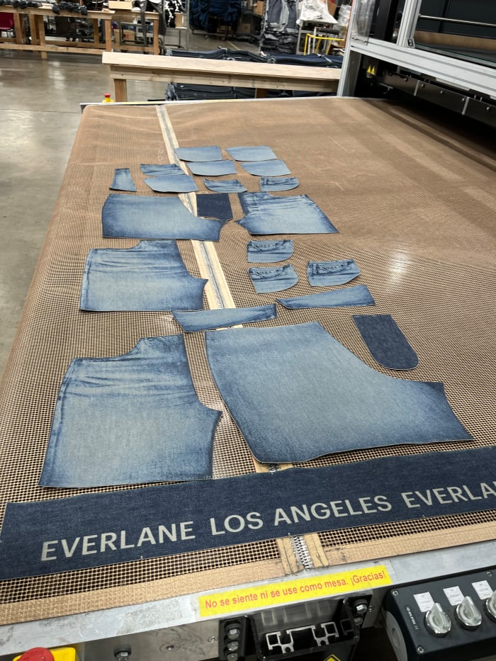 Laser-cut and -faded pieces for Everlane shorts, ready to be sewn together.