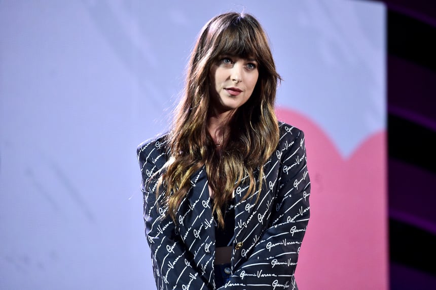 Dakota Johnson, a perfect-bang-owner, asking you with her eyes to put down the scissors.