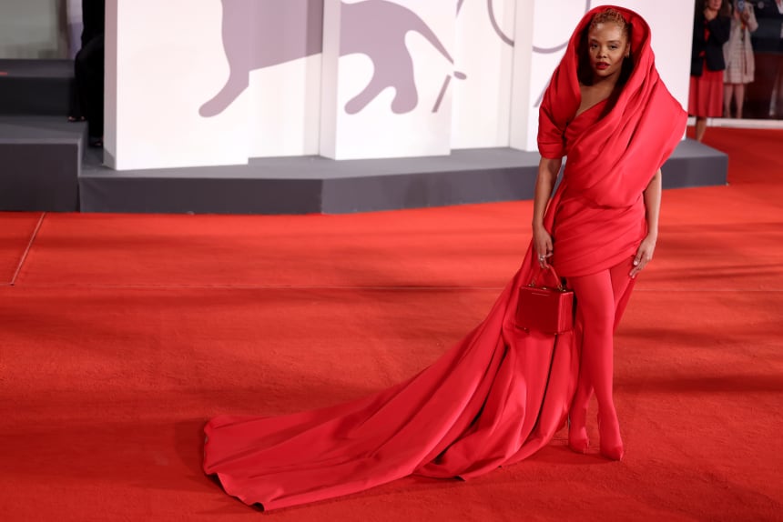Tessa Thompson carrying a Brandon Blackwood bag on the red carpet at the 2022 Venice Film Festival.