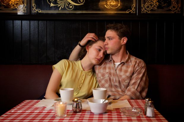 Eilis (Saoirse Ronan) in the yellow dress inspired by Dicks-Mireaux's mother and a plaid-sporting Tony (Emory Cohen). Photo: Kerry Brown/Twentieth Century Fox Film Corporation