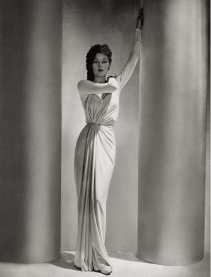 Lud models a dress by Alix, Madame Grès' first alias under which she opened a French couture house.