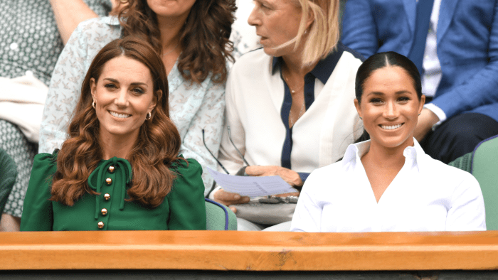 Meghan Markle, Duchess of Sussex, in a Hugo Boss skirt and Kate Middleton, Duchess of Cambridge, in a Dolce & Gabbana Dress at the Wimbledon women's singles final in London, England. Photo: Karwai Tang/Getty Images