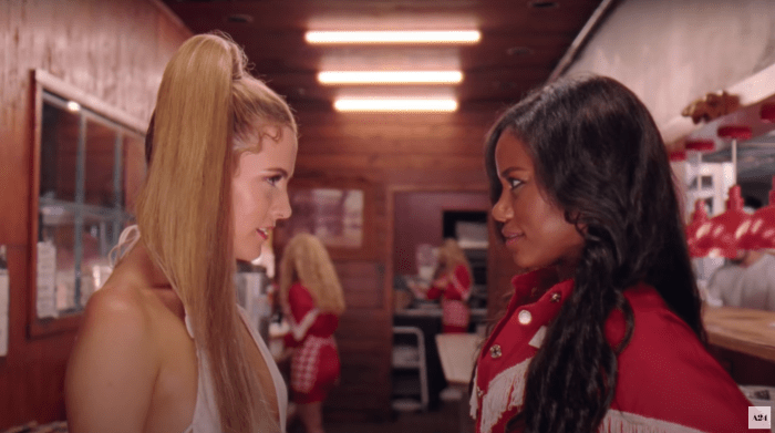 Stefani (Riley Keough) in vintage Dior from Gabriel Held meets Zola (Taylour Paige) in Fashion Brand Company.