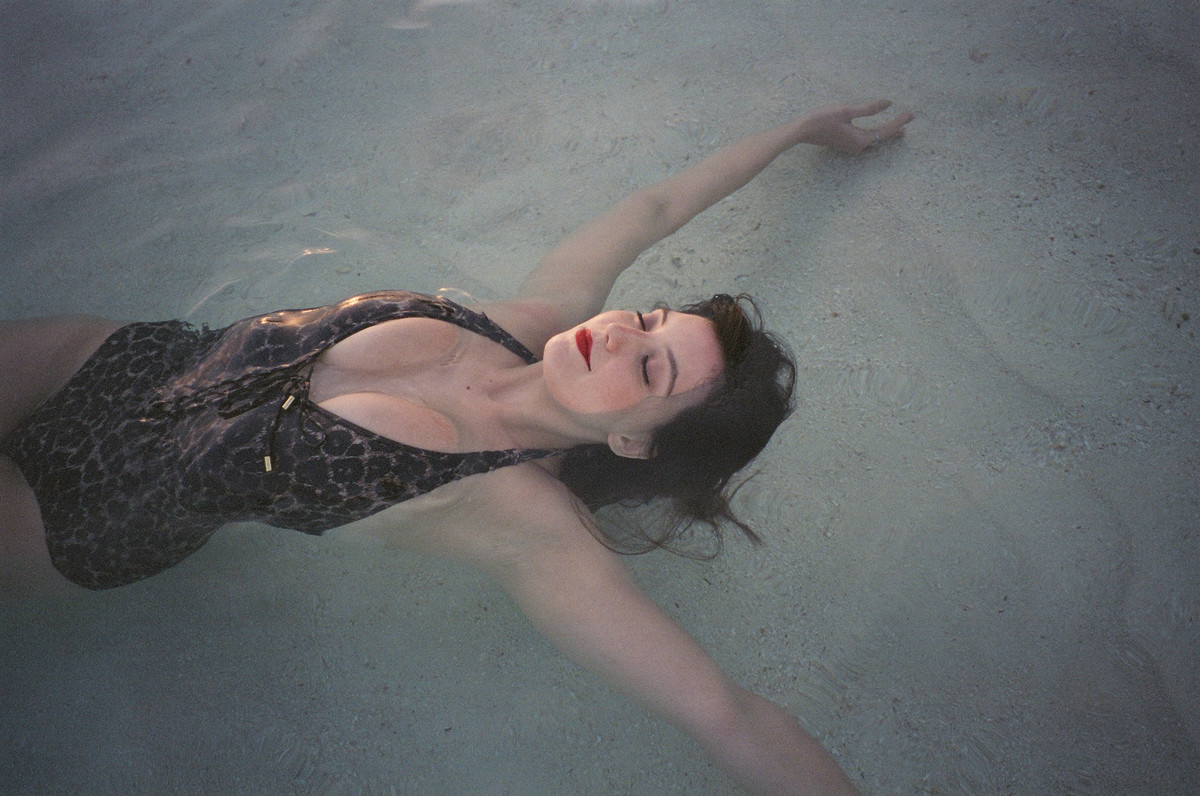Daisy Lowe in the sea, Maldives. Photo: Alexa Chung/Paper