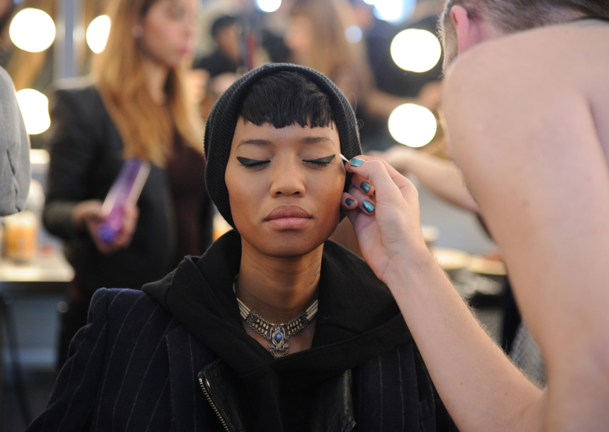 A model gets her makeup done during New York Fashion Week. Photo: Ilya S. Savenok/Getty Images