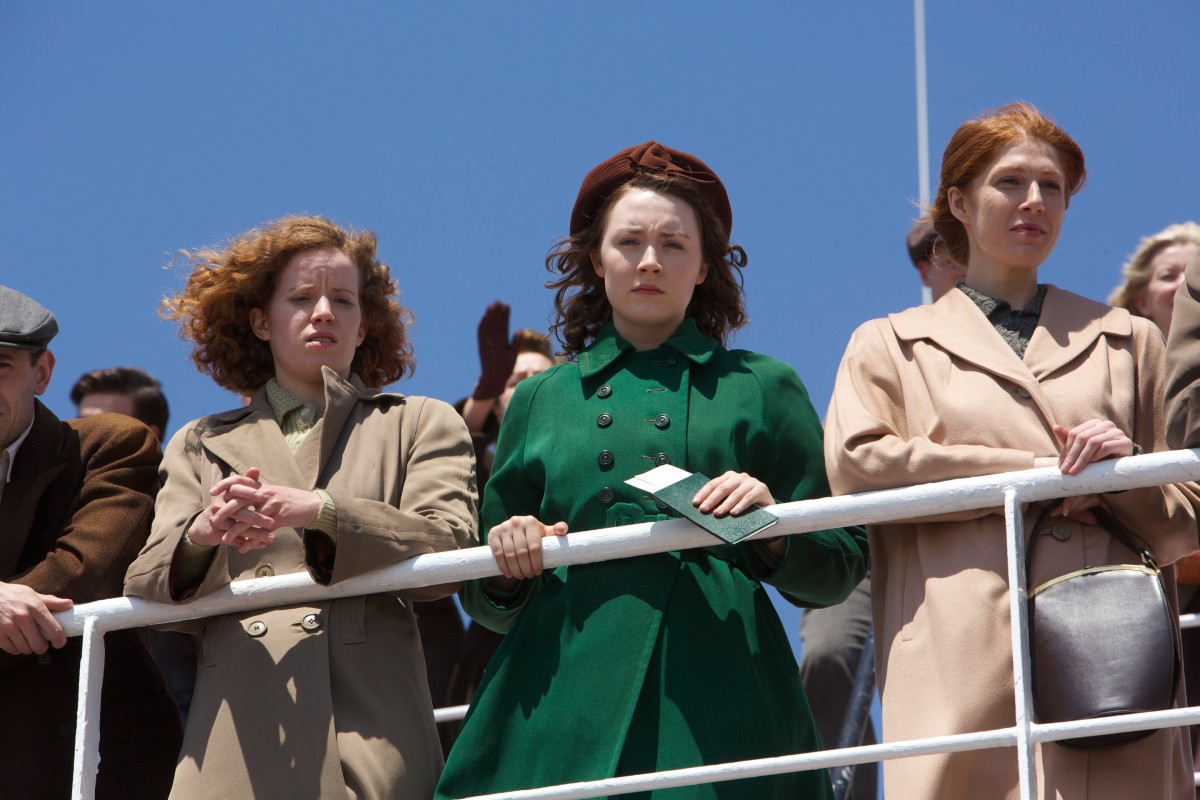 Eilis Lacey (Saoirse Ronan) wearing her lone coat and saying goodbye to Ireland for the sunny shores of Brooklyn. Photo: Kerry Brown/2015 Twentieth Century Fox Film Corporation