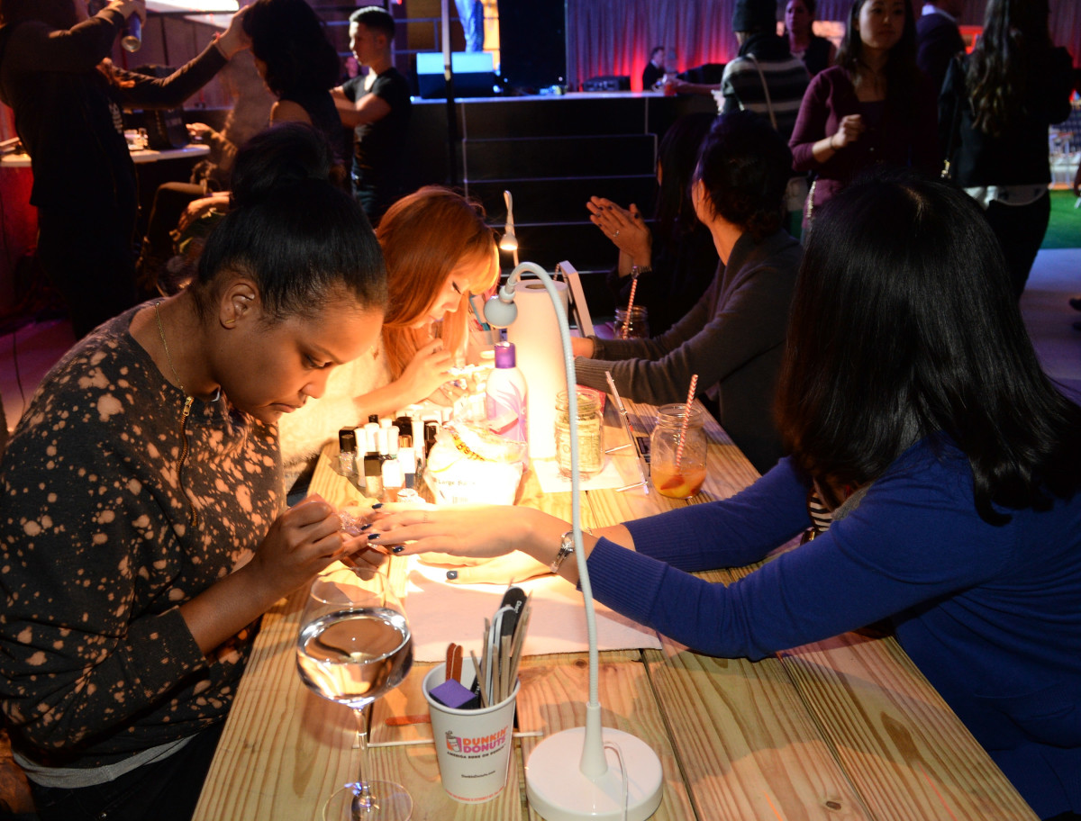 Women get manicures during a Smirnoff Ice event. Photo: Rick Diamond/Getty Images 