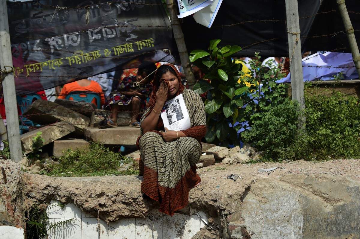 A relative of one of the factory workers killed in the Rana Plaza factory collapse on the second anniversary of the disaster. Photo: Munir Uz Zaman/Getty Images