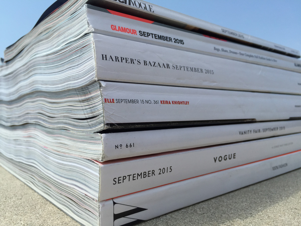 Behold the spines of the fashion magazines whose ad pages we counted three times. Photo: Fashionista