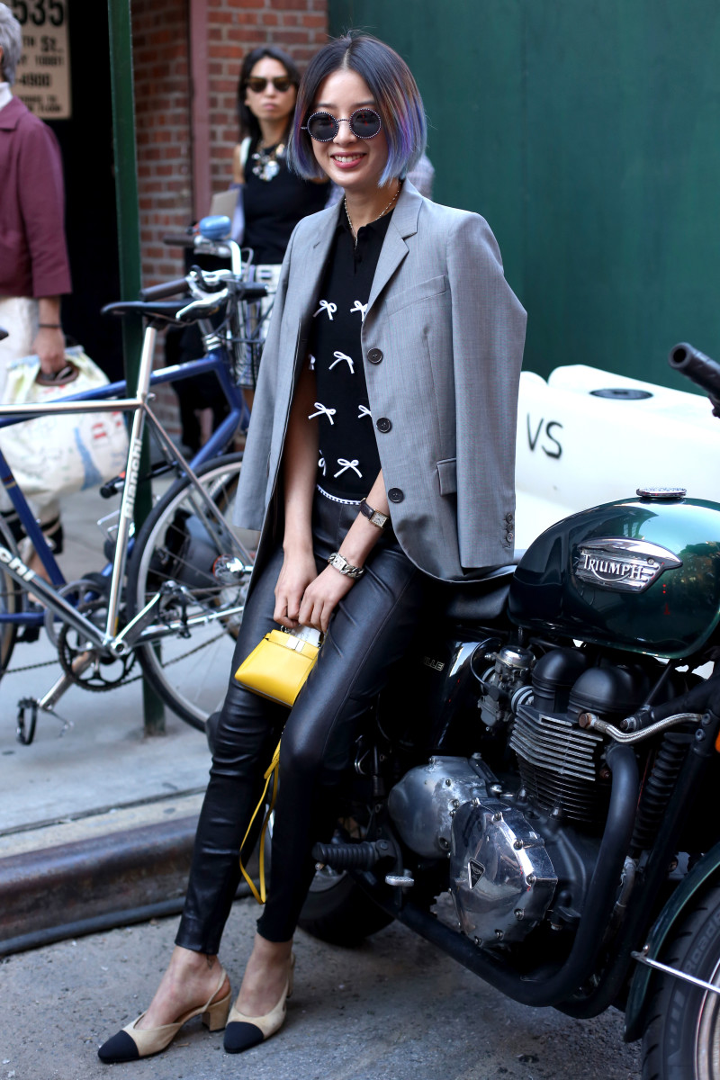 Model Irene Kim at New York Fashion Week in a Thom Browne jacket, Adam Selman top, Polo Ralph Lauren pants, Chanel slingbacks and Fendi bag. Photo: Angela Datre/Fashionista