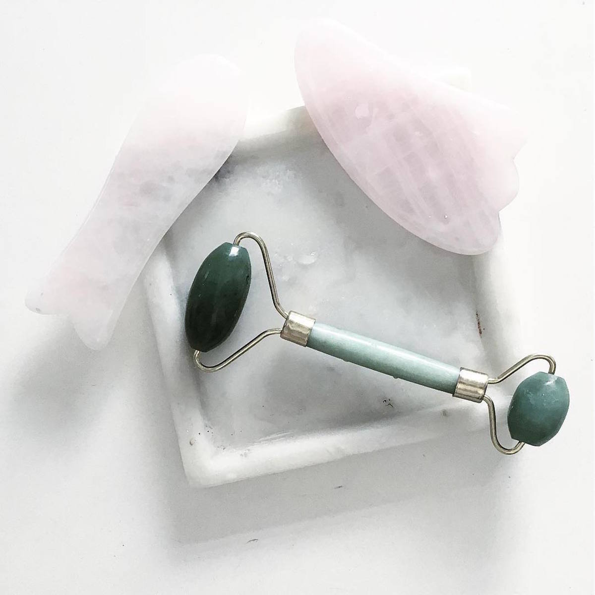 A jade roller chilling with some other chill skin-care tools. Photo: @minimalbeauty/Instagram