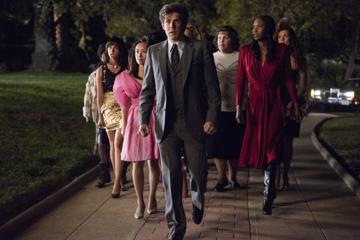 Bash (Chris Lowell, center) in more conservative fare, surrounded by (L-R) Justine (Britt Baron), Jenny (Ellen Wong), Carmen (Brittney Young), Cherry and Rhonda (Kate Nash). Photo: Erica Parise/Netflix