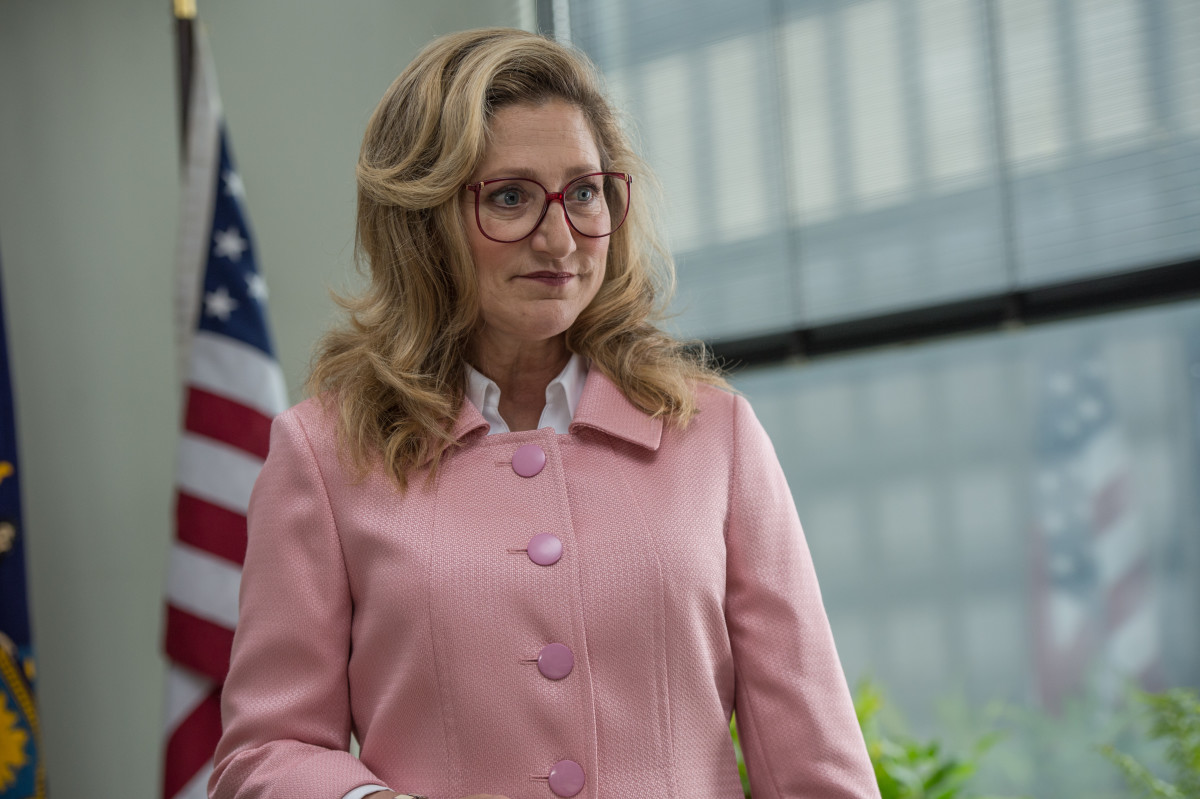 Pat (Edie Falco) in her HRC-inspired pink suit. Photo: Amazon Studios