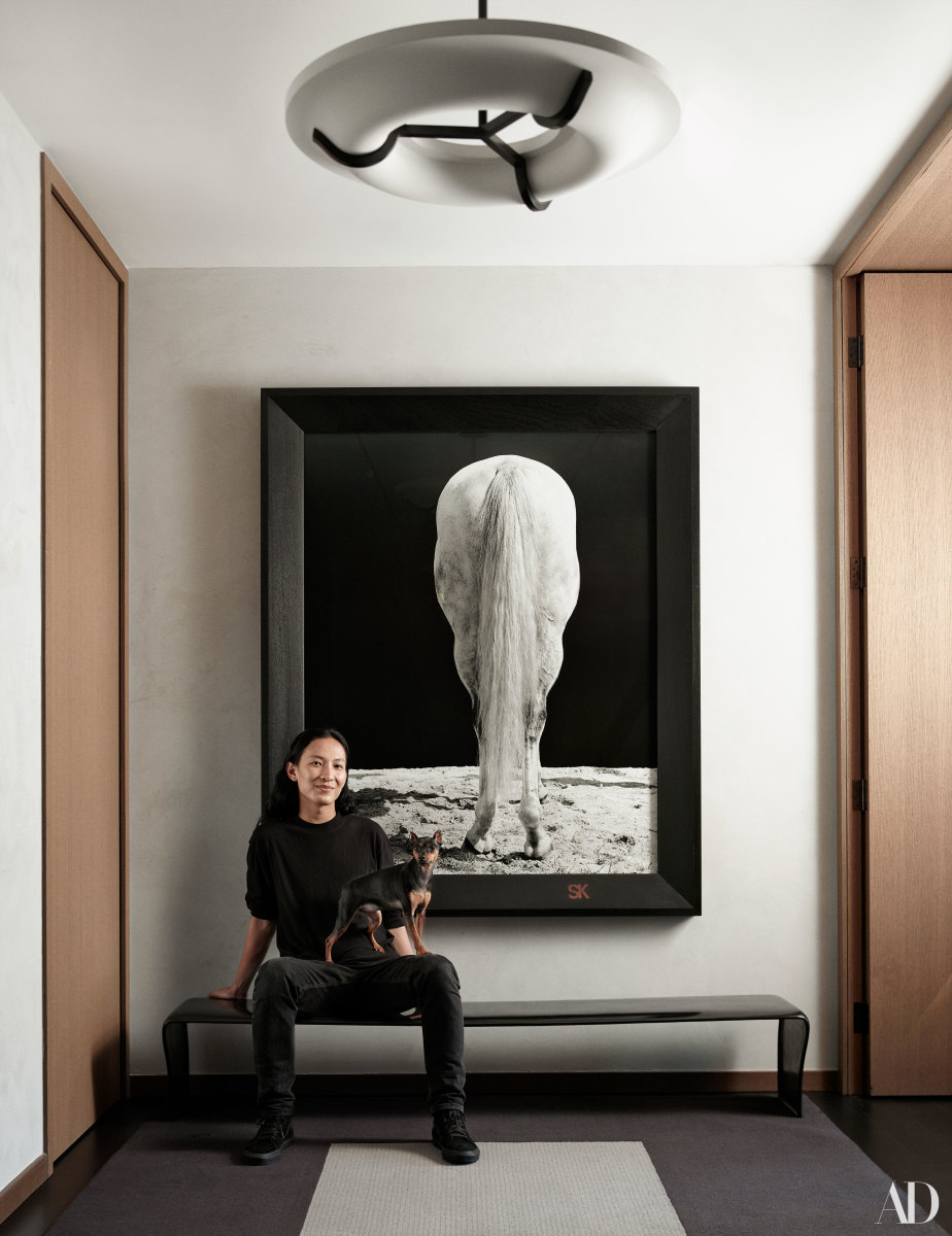 Alexander Wang and his Miniature Pinscher, Uni. Photo: Anthony Cotsifas/Courtesy of Architectural Digest