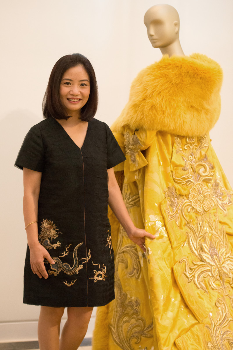 Designer Guo Pei at the Waterfall Mansion and Gallery with the dress famously worn by Rihanna in 2015. Photo: Julienne Schaer for China Institute