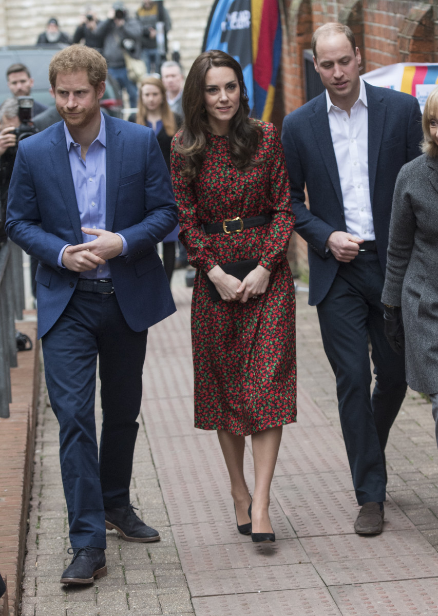 Flanked by Prince Harry and her husband, Prince William. Photo: Samir Hussein/Getty Images