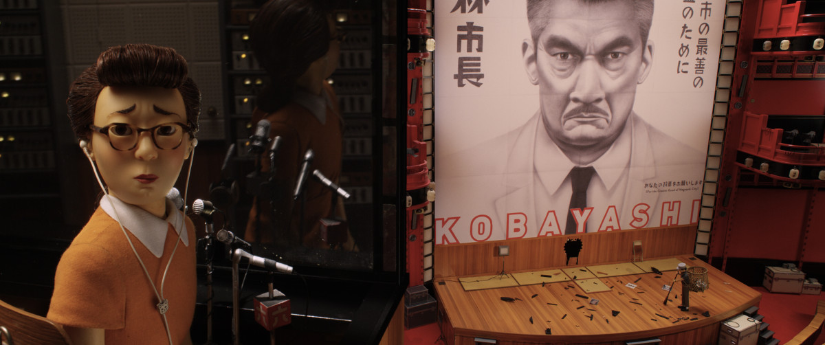 The Translator (Frances McDormand) and a poster of Mayor Kobayashi. Photo: Fox Searchlight